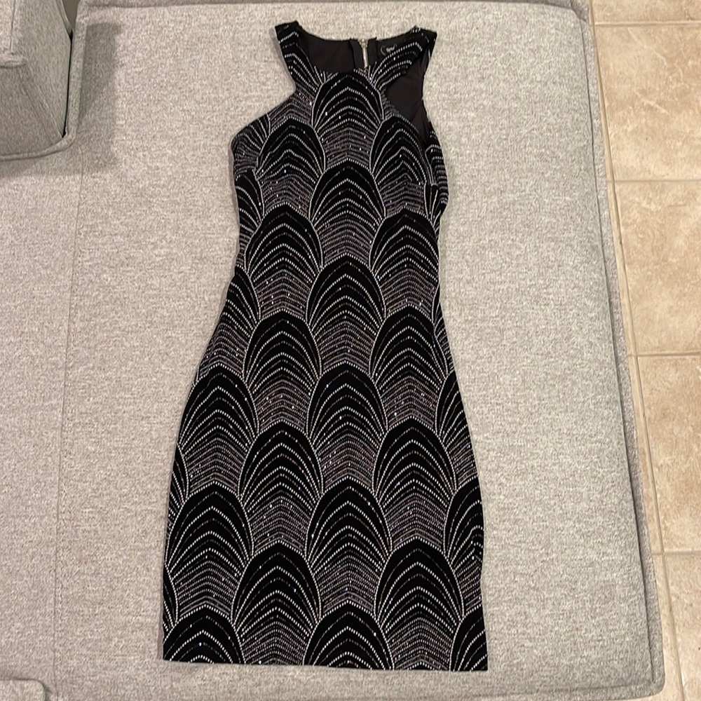 Speechless bodycon glitter dress fromMacy’s  with cutout on back